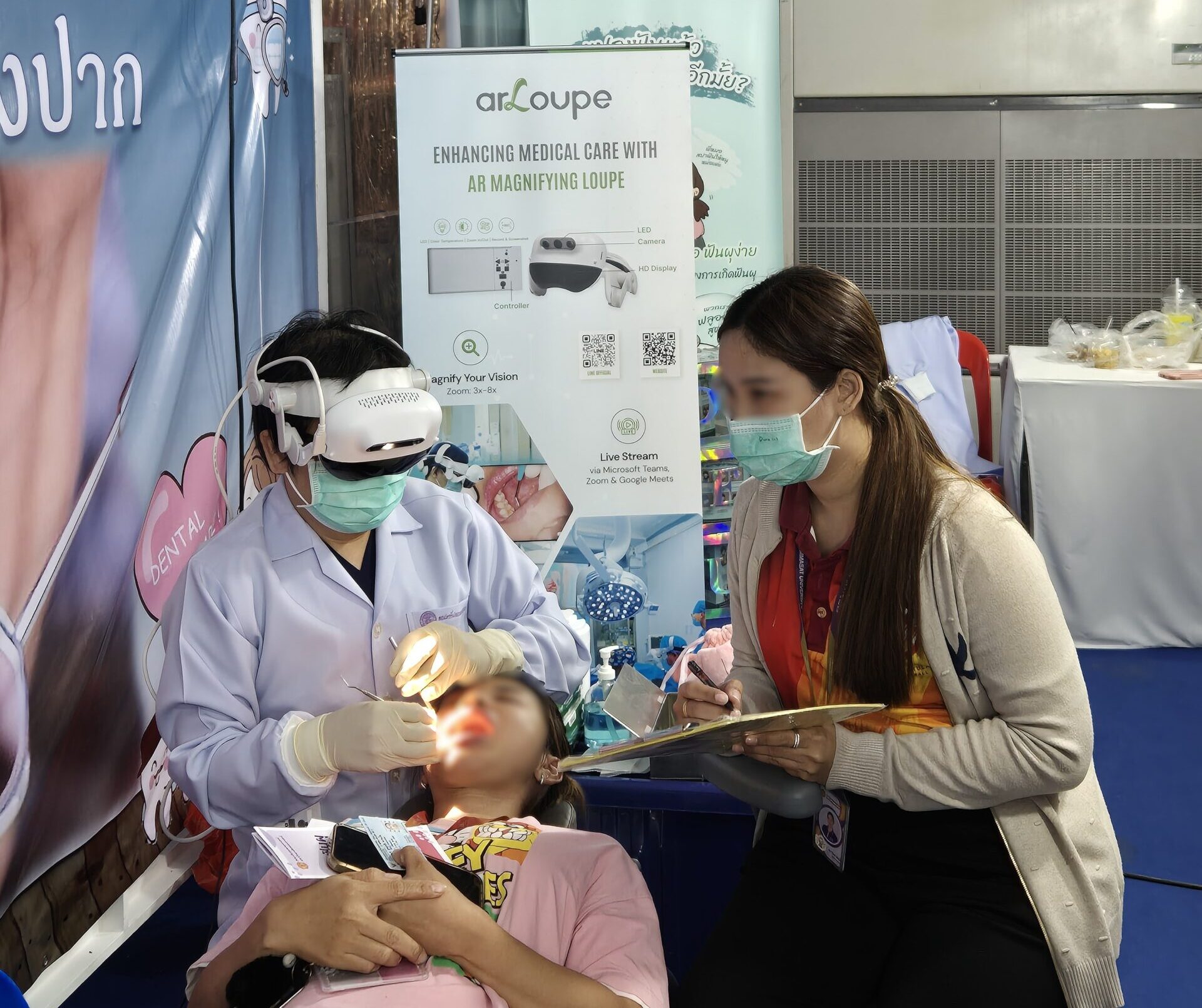 Doctor operating on patient with arLoupe